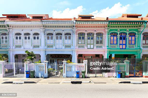 rows of peranakan houses in singapore in a day - peranakan culture stock pictures, royalty-free photos & images