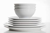Stack of white plates and bowls