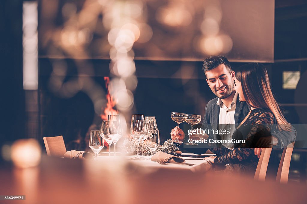 Young Couple Enjoying a Romantic Dinner Together