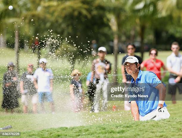 United States - Japan's Hideki Matsuyama makes a bunker shot on the No. 4 hole during his final round of the WGC Cadillac Championship tournament on...