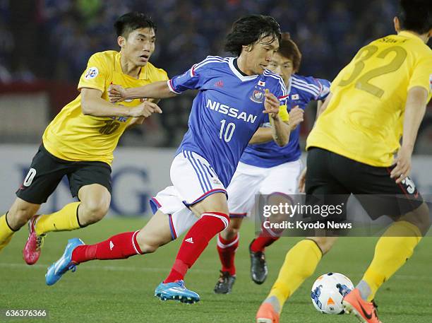 Japan - Yokohama F Marinos midfielder Shusuke Nakamura chases the ball during the first half of a Group G match against China's Guangzhou Evergrande...