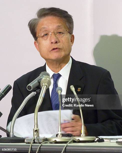 Japan - Keizo Fuchita, president of Urawa Reds, holds a press conference in Tokyo on March 13 following the J-League's decision to have the team play...