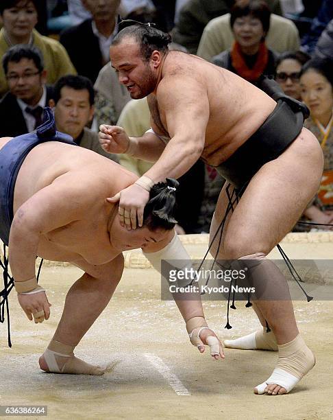 Japan - Eleventh-ranked maegashira Osunaarashi of Egypt thrusts down 14th-ranked maegashira Masunoyama at Bodymaker Colosseum in Osaka on March 15...