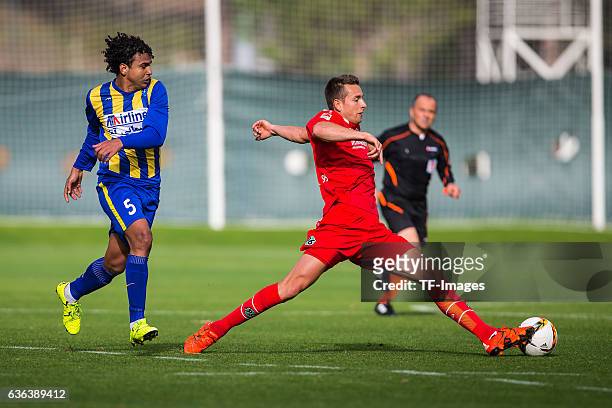 Magno of Gostaresh Foolad FC and Artur Sobiech of Hannover 96 battle for the ball during the Friendly Match between Hannover 96 and Gostaresh Foolad...
