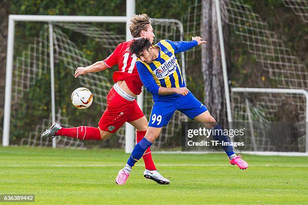 Felix Klaus of Hannover 96 and Amirhossein Karimi of Gostaresh Foolad FC battle for the ball during the Friendly Match between Hannover 96 and...