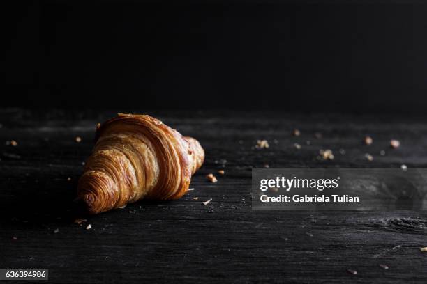 croissant on wooden background - croissant stock pictures, royalty-free photos & images