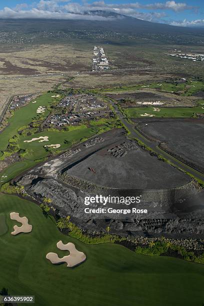 Coastal development consisting of homes, shopping malls, golf courses, condominiums and resort hotels is viewed on December 16 in this aerial photo...