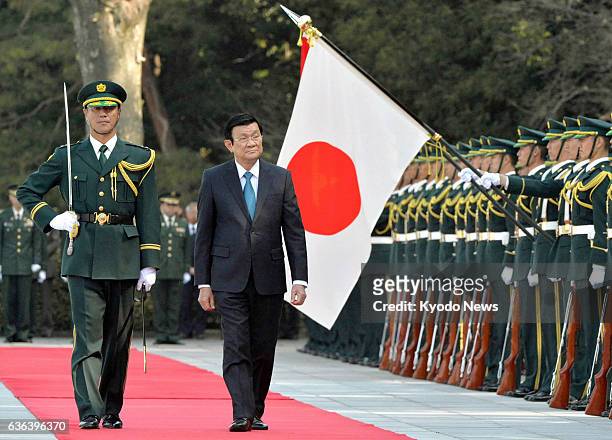 Japan - Vietnamese President Truong Tan Sang reviews an honor guard of Japan's Ground Self-Defense Force at the Imperial Palace in Tokyo on March 17,...