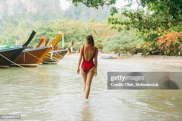 woman on beach in thailand - one piece stock pictures, royalty-free photos & images