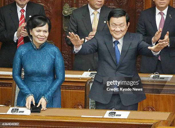 Japan - Vietnamese President Truong Tan Sang and his wife Mai Thi Hanh acknowledge applause from parliamentarians ahead of his speech at the Japanese...