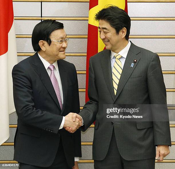 Japan - Japanese Prime Minister Shinzo Abe shakes hands with Vietnamese President Truong Tan Sang ahead of their talks at the prime minister's office...