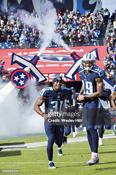 Kevin Byard and Tajae Sharpe of the Tennessee Titans run onto the field before a game against the Denver Broncos at Nissan Stadium on December 11,...