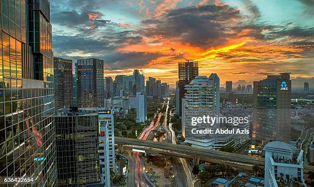 sudirman - jakarta burning sky - sudirman stock pictures, royalty-free photos & images