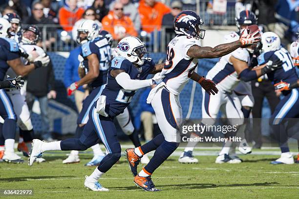 Demaryius Thomas of the Denver Broncos makes a one handed catch while being defended by Brice McCain of the Tennessee Titans at Nissan Stadium on...