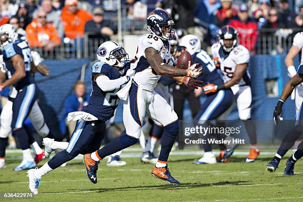 Demaryius Thomas of the Denver Broncos makes a one handed catch while being defended by Brice McCain of the Tennessee Titans at Nissan Stadium on...