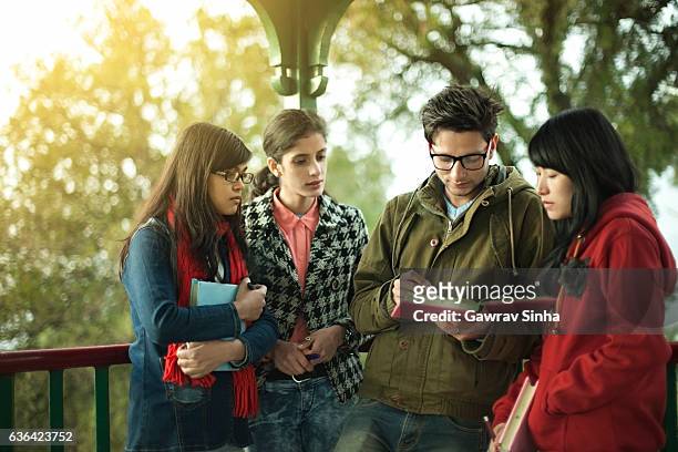multi ethnic asian university students teaching and learning together. - indian college girls stock pictures, royalty-free photos & images
