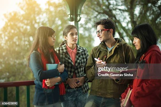 multi ethnic asian university students teaching and learning together. - winter testing imagens e fotografias de stock