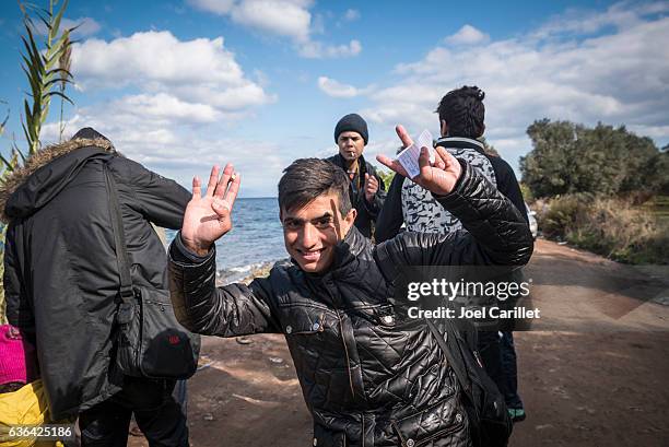 migrant arriving on lesbos, greece by boat - migration bildbanksfoton och bilder