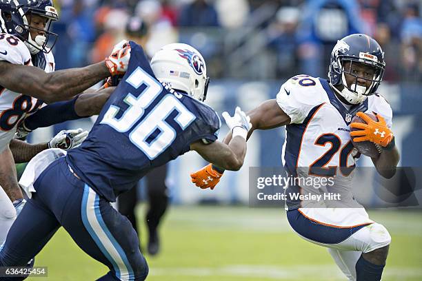 Justin Forsett of the Denver Broncos runs the ball during a game against the Tennessee Titans at Nissan Stadium on December 11, 2016 in Nashville,...