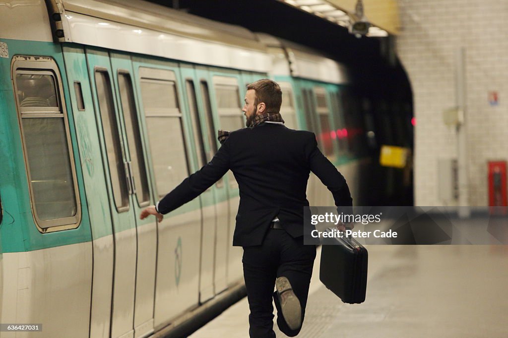 Man running for underground train