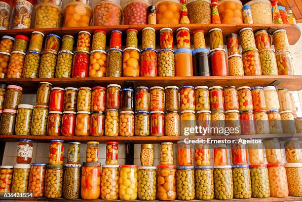 shelves with assorted pickles on essaouira market, morocco - mason jar stock pictures, royalty-free photos & images
