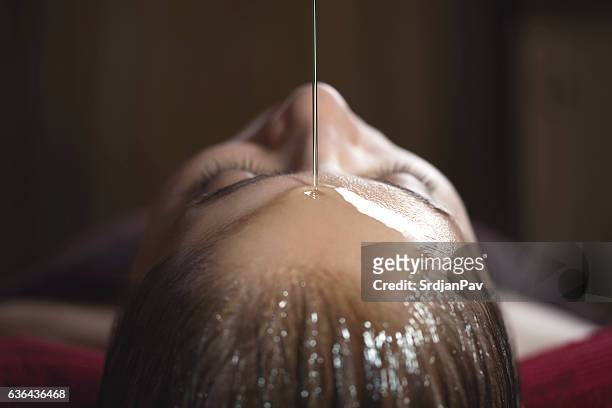 alternative medicine - massage oil stock pictures, royalty-free photos & images