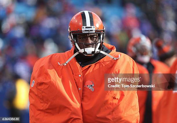Randall Telfer of the Cleveland Browns on the sideline as he wears an overcoat during NFL game action against the Buffalo Bills at New Era Field on...