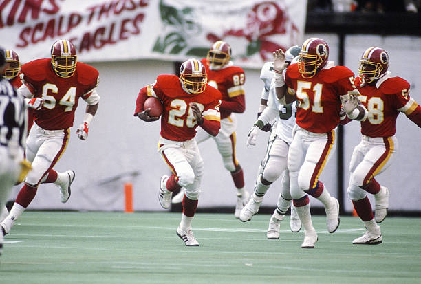 Darrell Green of the Washington Redskins returns an interception against the Philadelphia Eagles during an NFL football game December 8, 1985 at...