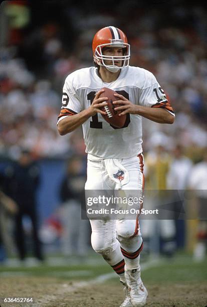 Bernie Kosar of the Cleveland Browns drops back to pass against the Houston Oilers during an NFL Football game October 29, 1989 at Cleveland...