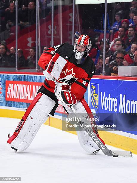 Carter Hart of Team Canada looks to play the puck during the IIHF exhibition game against Team Finland at the Bell Centre on December 19, 2016 in...