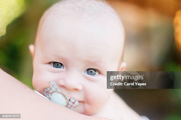 close up portrait baby with pacifier - dummy expression stock pictures, royalty-free photos & images