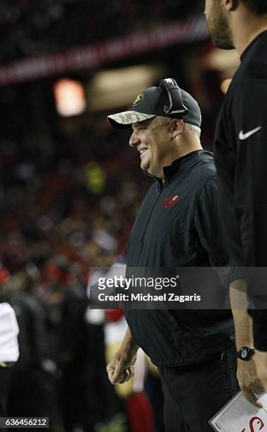 Head Coach Chip Kelly of the San Francisco 49ers stands on the sideline during the game against the Atlanta Falcons at the Georgia Dome on December...