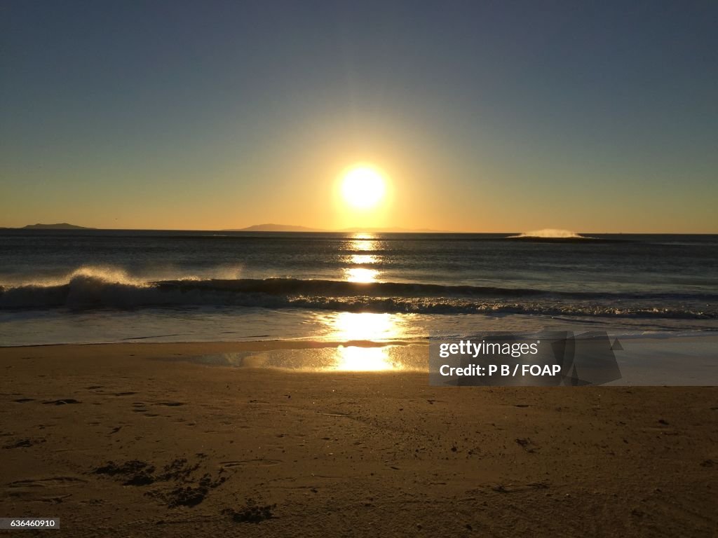 Scenic view of sea at dusk