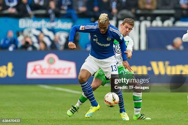 Eric Maxim CHOUPO-MOTING of Schalke 04 and Sebastian JUNG of VfL Wolfsburg battle for the ball during the Bundesliga match between FC Schalke 04 and...