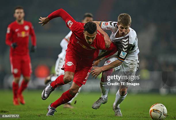 Davie Selke of RB Leipzig and Daniel Buballa of St. Pauli battle for the ball during the Second Bundesliga match between FC St. Pauli and...