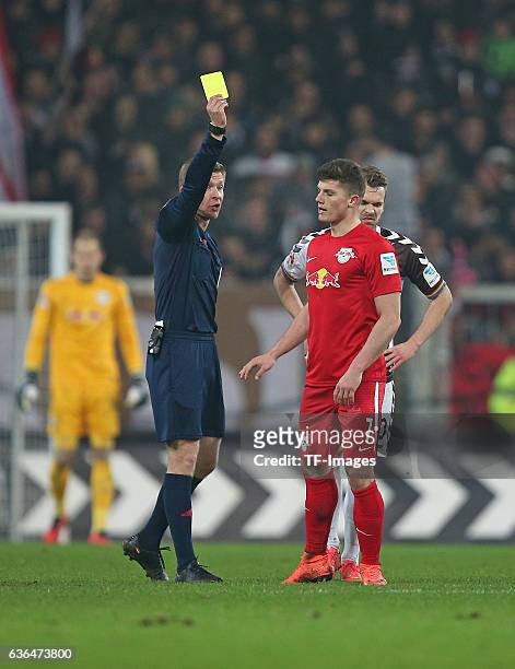 Referee Tobias Welz shows the yellow card to Marcel Sabitzer of RB Leipzig and Christopher Buchtmann of St. Pauli "n during the Second Bundesliga...
