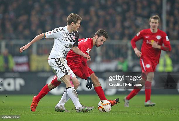 Daniel Buballa of St. Pauli and Massimo Bruno of RB Leipzig battle for the ball during the Second Bundesliga match between FC St. Pauli and...