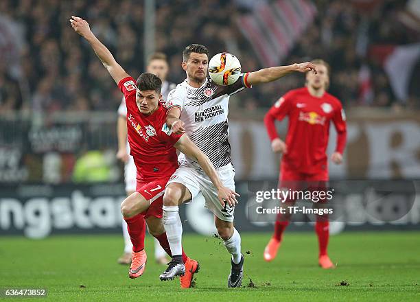 Marcel Sabitzer of RB Leipzig and Enis Alushi of St. Pauli battle for the ball during the Second Bundesliga match between FC St. Pauli and...