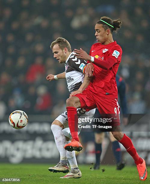 Lennart Thy of St. Pauli and Yussuf Poulsen of RB Leipzig battle for the ball during the Second Bundesliga match between FC St. Pauli and...