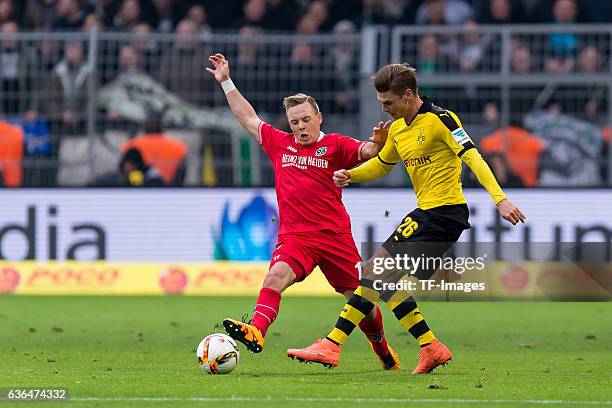 Uffe Manich Bech of Hannover 96 and Lukasz Piszczek of Bosussia Dortmund battle for the ball during the Bundesliga match between Borussia Dortmund...