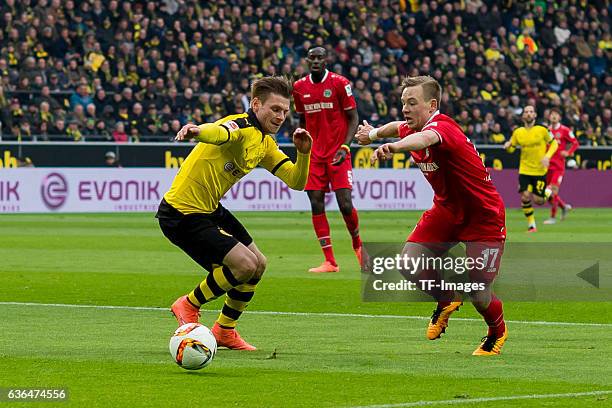 Lukasz Piszczek of Bosussia Dortmund and Uffe Manich Bech of Hannover 96 battle for the ball during the Bundesliga match between Borussia Dortmund...