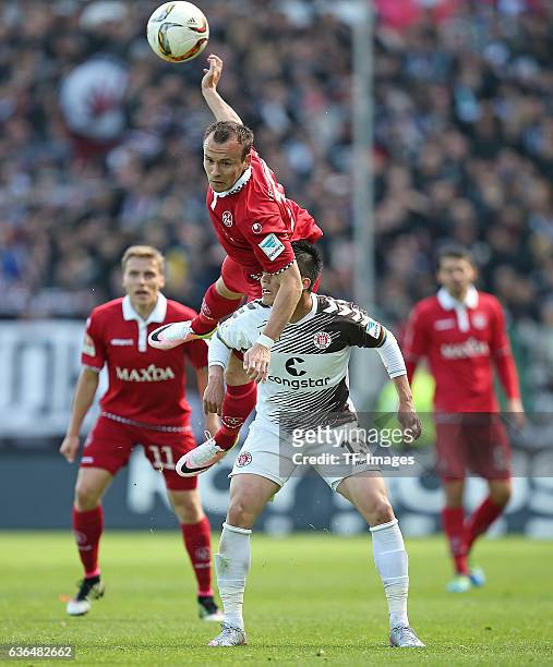 Andre Fomitschow of Kaiserslautern and Ryo Miyaichi of FC St. Pauli battle for the ball during the Second Bundesliga match between FC St. Pauli and...