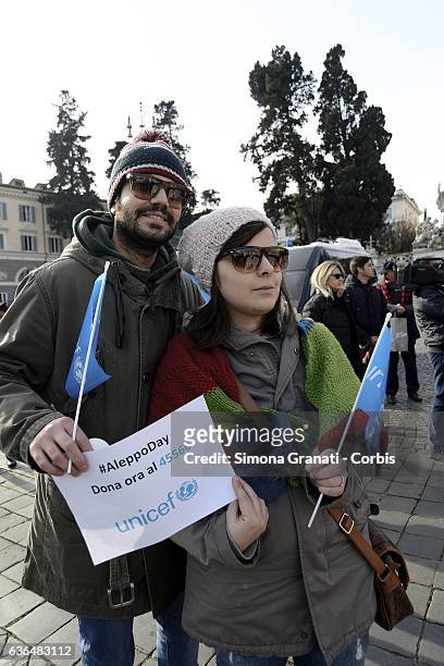 Citizens of Rome in Piazza del Popolo with blankets to warm symbolically the Syrian children during the UNICEF demonstration in conjunction of Aleppo...