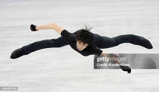 Japan - Sochi Olympic men's figure skating champion Yuzuru Hanyu of Japan takes part in an official practice session at Saitama Super Arena in...
