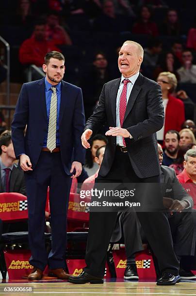 Head coach Chris Mullin and assistant coach Greg St. Jean of the St. JohnÕs Red Storm look on against the Penn State Nittany Lions at Madison Square...