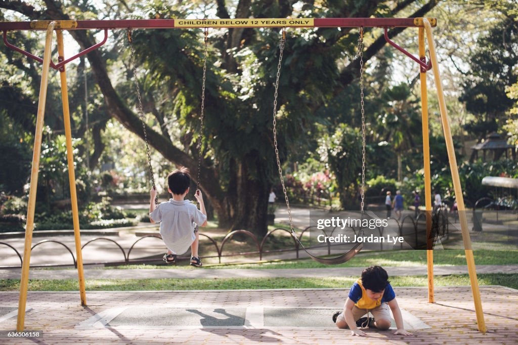 Boy fall down from Swing