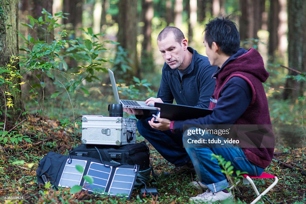 Environmentalists monitor the forest with a solar powered field laboratory