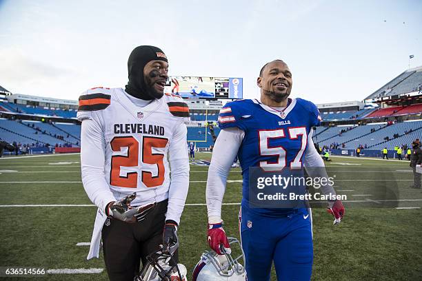 George Atkinson of the Cleveland Browns and Lorenzo Alexander of the Buffalo Bills talk as they exit the field after the game on December 18, 2016 at...