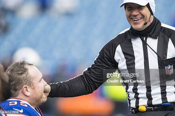 Referee Clete Blakeman speaks with Kyle Williams of the Buffalo Bills before the game against the Cleveland Browns on December 18, 2016 at New Era...