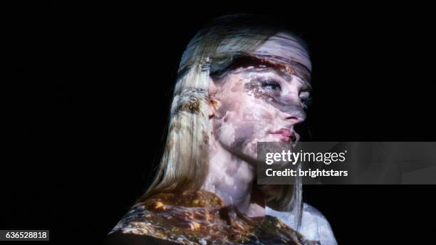 sea waves on a woman's face - face projection stock pictures, royalty-free photos & images